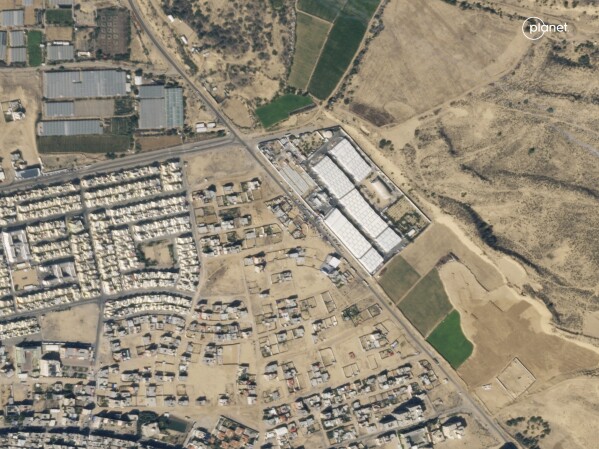 This satellite image provided by Planet Labs PBC shows the southern Gaza town of Rafah on Oct 13, 2023. The town is normally home to 280,000 people. But its population has swelled to over 1.5 million – roughly three quarters of Gaza's population -- as people flee fighting elsewhere in Gaza. Sprawling tent camps now dot the city. (Planet Labs PBC via AP)