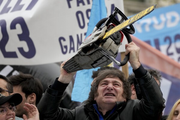 Presidential hopeful Javier Milei brandishes a chainsaw during a campaign event in La Plata, Argentina, Tuesday, Sept. 12, 2023.  (AP Photo/Natacha Pisarenko)