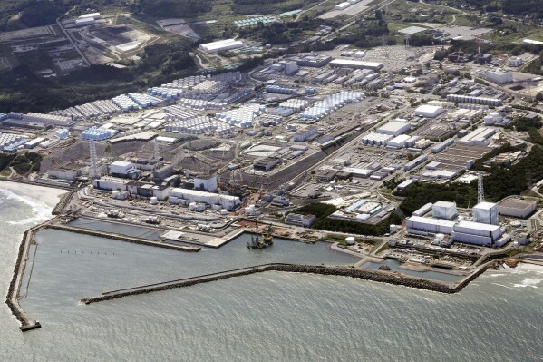 FILE - This aerial view shows the wrecked Fukushima Daiichi nuclear power plant in Okuma town, northeastern Japan, on Aug. 24, 2023. A drone small enough to fit in one's hand flew inside one of the damaged reactors at the wrecked nuclear power plant Wednesday, Feb. 28, 2024, in hopes it can examine some of the molten fuel debris in areas where earlier robots failed to reach. (Kyodo News via AP, File)