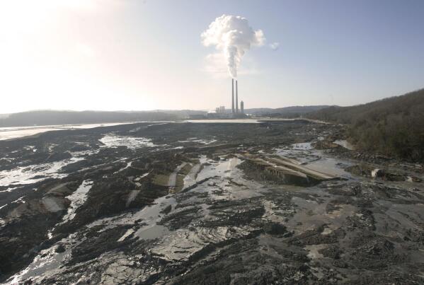 FILE - This Dec. 22, 2008, photo shows the aftermath of a retention pond wall collapse at the TVA Kingston Fossil Plant in Harriman, Tenn. Workers who cleaned up the 2008 Kingston, Tenn., coal ash spill spent years working in conditions that they believe made them sick. The first worker lawsuits were filed against cleanup contractor Jacobs Engineering in 2013. But nearly a decade later, not a single case has made it through the court system. The Tennessee Supreme Court is scheduled to hear oral arguments on Wednesday, June 1, 2022. (AP Photo/Wade Payne, File)