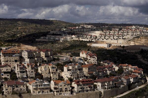 FILE - A general view shows the West Bank Jewish settlement of Efrat on March 10, 2022. The online travel agency Booking.com said on Monday, Sept. 19, 2022, that it plans to add warnings to listings in the Israeli-occupied West Bank, becoming the latest foreign company to wade into one of the world’s most contentious debates. (AP Photo/Maya Alleruzzo, File)