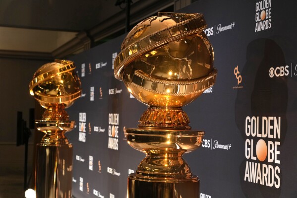 FILE - Replicas of Golden Globe statues appear at the nominations for the 81st Golden Globe Awards at the Beverly Hilton Hotel on Monday, Dec. 11, 2023, in Beverly Hills, Calif. The 81st Golden Globe Awards will be held on Sunday, Jan. 7, 2024. (AP Photo/Chris Pizzello, File)