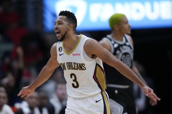 New Orleans Pelicans guard CJ McCollum (3) reacts after scoring a 3-point shot in the second half of an NBA basketball game against the San Antonio Spurs in New Orleans, Thursday, Dec. 22, 2022. The Pelicans won 126-117. (AP Photo/Gerald Herbert)