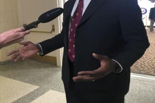 Dr. Joseph Ladapo speaks with reporters after the Florida Senate confirmed his appointment as the state's surgeon general on Feb. 23, 2022, in Tallahassee, Fla. (AP Photo/Brendan Farrington)