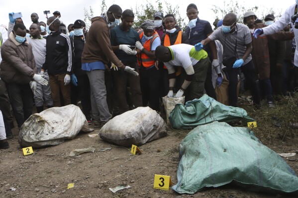Sacks with human remains are seen after being removed from a quarry in Mukuru Kwa Njenga area in Nairobi, Kenya Saturday, July 13, 2024. Police in Kenya said Monday they have arrested the main suspect after nine dismembered bodies of women were found in a quarry in the capital, Nairobi. (ĢӰԺ Photo/Andrew Kasuku)