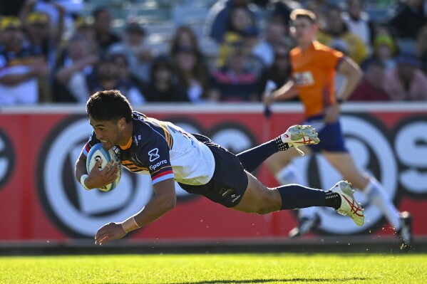 Tamati Tua of the Brumbies scores a try during the Super Rugby game against the Hurricanes in Canberra, Australia, Saturday, April 27, 2024. (Lukas Coch/AAP Image via AP)