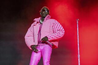 FILE - Young Thug performs on Day 4 of the Lollapalooza Music Festival on Aug. 1, 2021, at Grant Park in Chicago. The Atlanta rapper who’s accused of conspiracy to violate Georgia’s RICO Act and participation in a criminal street gang, is facing six new felony charges along with four others linked to the case. A new indictment was filed in Fulton County Superior Court last week against the artist, whose real name is Jeffery Williams. (Photo by Amy Harris/Invision/AP, File)