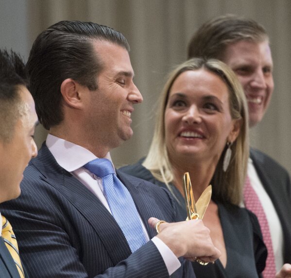 
              FILE - In this Feb. 28, 2017 file photo, Donald Trump Jr. jokingly plays with scissors as his wife Vanessa laughs at the grand opening of the Trump International Hotel and Tower in Vancouver, Canada. A public court record filed Thursday, March 15, 2018 in New York says Vanessa Trump is seeking an uncontested divorce from the president's son. Details of the divorce complaint haven't been made public. (Jonathan Hayward/The Canadian Press via AP, File)
            