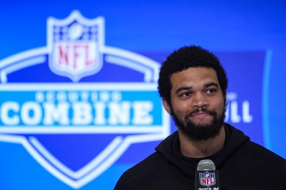 FILE - Southern California quarterback Caleb Williams speaks during a press conference at the NFL football scouting combine in Indianapolis, Friday, March 1, 2024. Williams is expected to be taken in the first round of the NFL Draft. (AP Photo/Michael Conroy, File)
