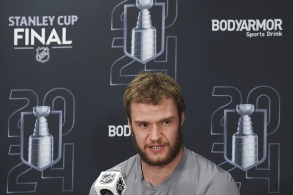 Florida Panthers forward Aleksander Barkov speaks to the media the day after Game 1 of the NHL Stanley Cup final against the Edmonton Oilers in Fort Lauderdale, Fla., Sunday, June 9, 2024. (Nathan Denette/The Canadian Press via AP)