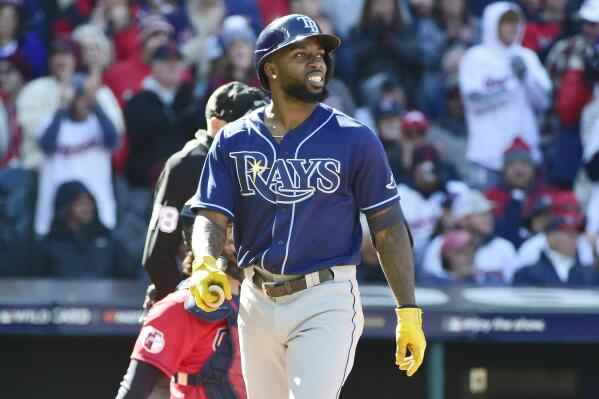 Tampa Bay Rays' Randy Arozarena walks back to the dugout after striking out in the ninth inning of a wild card baseball playoff game against the Cleveland Guardians, Saturday, Oct. 8, 2022, in Cleveland. (AP Photo/Phil Long)