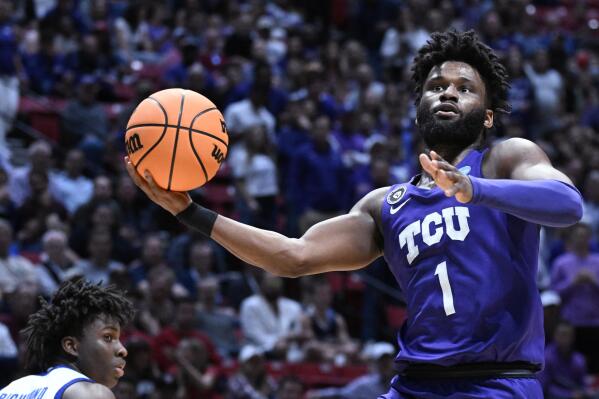 FILE - TCU guard Mike Miles Jr. drives to the basket during the first half of the team's first-round NCAA college basketball tournament game against Seton Hall on March 18, 2022, in San Diego.  (AP Photo/Denis Poroy, File)