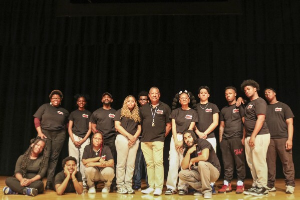 This image, released by Carnegie Mellon University, shows Gary Edwin Robinson, who won the Excellence in Theatre Education Award for 2025, along with students from a boys and girls' high school in New York's Brooklyn area on May 7, 2025 (Pam Wiggly/Carnegie Mellon University via the AP)