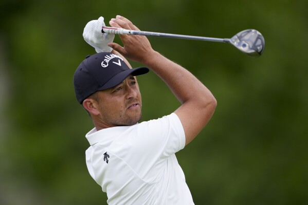 Xander Schauffele watches his tee shot on the fourth hole during the third round of the PGA Championship golf tournament at the Valhalla Golf Club, Saturday, May 18, 2024, in Louisville, Ky. (AP Photo/Matt York)