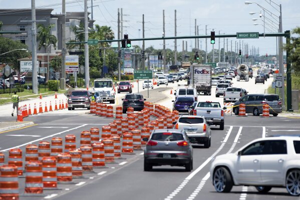 Southbound drivers use a northbound lane to cross the Roosevelt Bridge because of a crack found on the south end of the bridge Wednesday, June 17, 2020, in Stuart, Fla. Traffic was backed up in the southbound lanes of U.S. 1 north of the bridge and many drivers sought alternate routes.  (Leah Voss/TCPalm.com via AP)