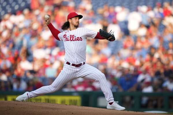 Philadelphia Phillies' Michael Lorenzen pitches during the first inning of a baseball game against the Washington Nationals, Wednesday, Aug. 9, 2023, in Philadelphia. (AP Photo/Matt Slocum)