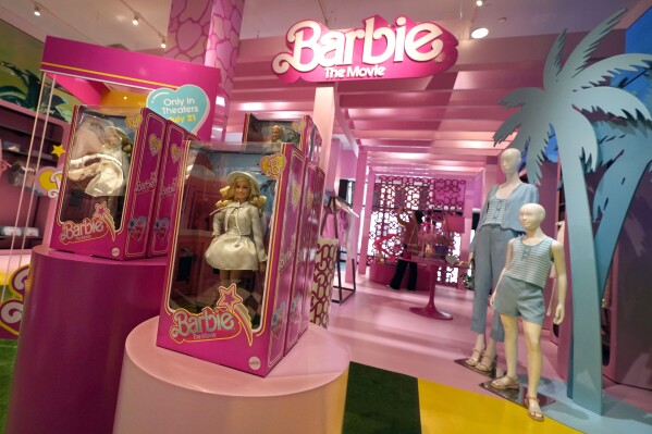FILE - Barbie-themed merchandise is displayed in a special section at Bloomingdale's, in New York, July 20, 2023. Toy company Mattel Inc., who owns Barbie, turned in a pleasant surprise for investors: a profit and better sales than analysts expected. Their quarterly earnings report Wednesday, July 26, comes as the El Segundo, California-based company is basking in the spotlight of “Barbie,