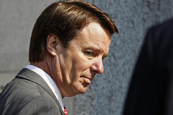 FILE - In this Friday, March 25, 2012 file photo, former U.S. presidential candidate and Sen. John Edwards arrives at a federal court for the sixth day of jury deliberations in Greensboro, N.C.. (AP Photo/Gerry Broome, File)