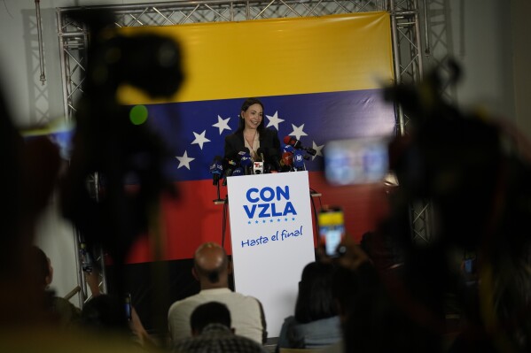 María Corina Machado, a former lawmaker and longtime government foe, speaks to the press in Caracas, Venezuela, Tuesday, Oct. 24, 2023. Machado continued to dominate the primary election held to pick the opposition's candidate to challenge Venezuelan President Nicolás Maduro next year, holding her support above 90% in the latest partial returns announced Monday. (AP Photo/Ariana Cubillos)