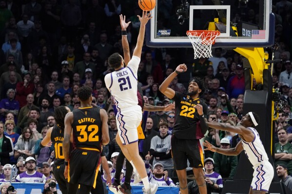 FILE - TCU forward JaKobe Coles (21) drives the lane for a basket past Arizona State forwards Alonzo Gaffney (32) and Warren Washington (22) during the second half of a first-round college basketball game in the men's NCAA Tournament, March 17, 2023, in Denver. Coles hit the winning shot with 1.5 seconds left in the first round to beat Arizona State. (AP Photo/John Leyba, File)