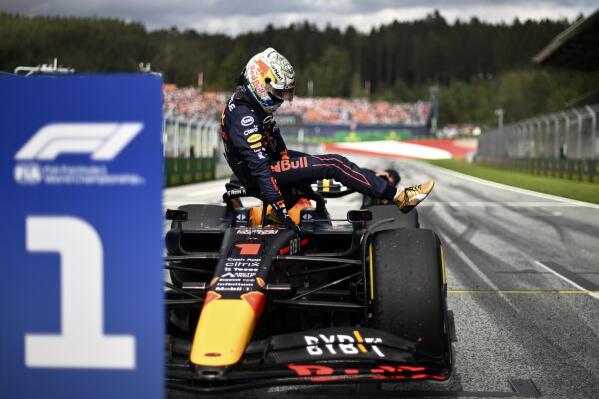 Red Bull driver Max Verstappen of the Netherlands leaves the car after winning the Sprint Race qualifying session at the Red Bull Ring racetrack in Spielberg, Austria, Saturday, July 9, 2022. The Austrian F1 Grand Prix will be held on Sunday July 10, 2022. (Christian Bruna/Pool via AP)