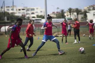 Women players of Fath Union Sport soccer team take part in a training session in Rabat, Morocco, Friday, May 19, 2023. (AP Photo/Mosa'ab Elshamy)