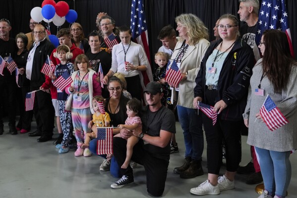 Afrikaner refugees from South Africa arrive, Monday, May 12, 2025, at Dulles International Airport in Dulles, Va. (AP Photo/Julia Demaree Nikhinson)