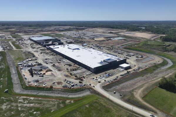 An electric and hybrid vehicle battery factory being built by Toyota is shown while under construction near Greensboro, North Carolina on Monday, May 15, 2023. The plant will supply batteries to Toyota's huge complex in Georgetown, Kentucky, which will build Toyota's first U.S.-made electric vehicle. (Toyota via AP)