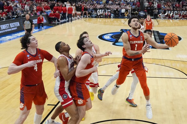 Clemson guard Chase Hunter (1) scores during the second half of a Sweet 16 college basketball game against Arizona in the NCAA tournament Thursday, March 28, 2024, in Los Angeles. (AP Photo/Ashley Landis)