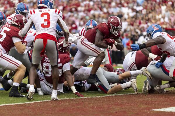 Alabama running back Brian Robinson Jr. (4) runs the ball in for a touchdown against Mississippi during the second half of an NCAA college football game, Saturday, Oct. 2, 2021, in Tuscaloosa, Ala. (AP Photo/Vasha Hunt)