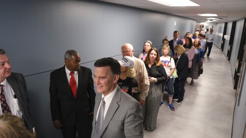 CORRECTS DATE TO JUNE 22, NOT JUNE 21 - A line of people wanting to attend the Oklahoma State Board of Education meeting extends down a hallway, Thursday, June 22, 2023, in Oklahoma City. (Doug Hoke/The Oklahoman via AP)