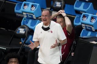 Oklahoma head coach Lon Kruger reacts during the first half of a first-round game against Missouri in the NCAA men's college basketball tournament at Lucas Oil Stadium, Saturday, March 20, 2021, in Indianapolis. (AP Photo/Darron Cummings)