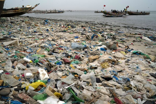 FILE - Trash and plastics litter the sand of Yarakh Beach in Dakar, Senegal, Nov. 8, 2022. Negotiators at UN-led talks in Nairobi have failed to agree on how to advance work towards the development of a global treaty to end plastic pollution. Environmental advocates say some oil-producing governments used stalling tactics designed to ultimately weaken the treaty.(AP Photo/Leo Correa, File)