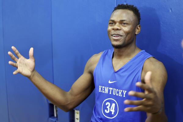 Kentucky's Oscar Tshiebwe answers a question during the school's NCAA college basketball media day in Lexington, Ky., Tuesday, Oct. 25, 2022. (AP Photo/James Crisp)