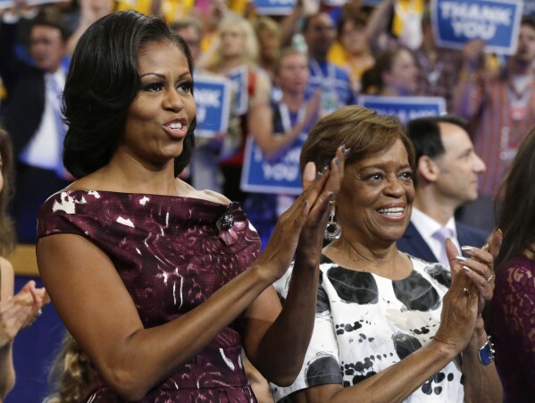 FILE - First lady Michelle Obama, left, and her mother Marian Robinson react as Ret. Navy Admiral John B. Nathman speaks to delegates at the Democratic National Convention in Charlotte, N.C., Sept. 6, 2012. Robinson, who moved with the first family to the White House when son-in-law Barack Obama was elected president, has died, according to an announcement by Michelle Obama and other family members Friday, May 31, 2024. (AP Photo/Charles Dharapak, File)