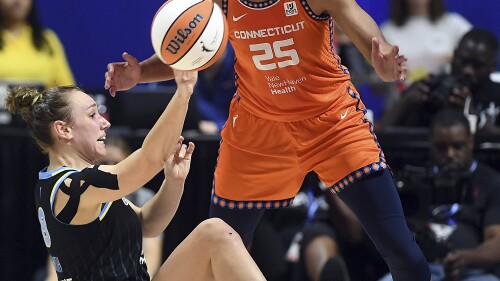 Chicago Sky's Alanna Smith (8) passes the ball past Connecticut Sun's Alyssa Thomas (25) during a WNBA basketball game, Sunday, May 25, 2023, in Uncasville, Conn. (Sarah Gordon/The Day via AP)