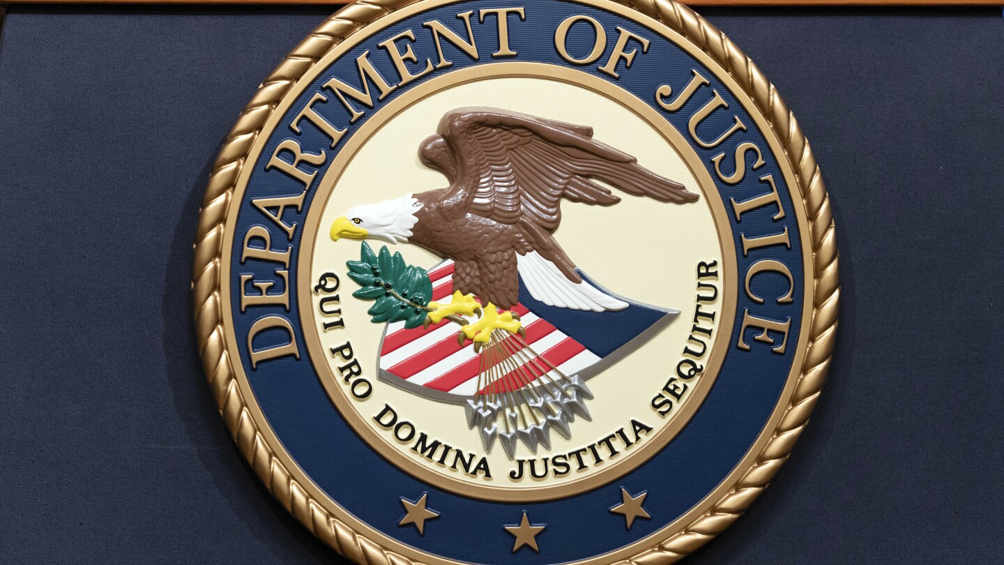 FILE - The Department of Justice seals is seen during a news conference at the DOJ office in Washington, May 16, 2023. (AP Photo/Jose Luis Magana, Fil