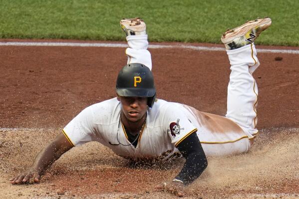 Pittsburgh Pirates' Ke'Bryan Hayes scores against the New York Mets during the third inning of a baseball game in Pittsburgh, Friday, June 9, 2023. (AP Photo/Gene J. Puskar)
