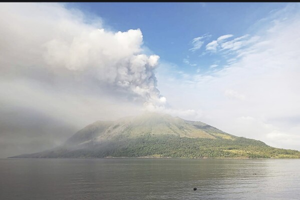 Mount Ruang volcano is seen during the eruption from Tagulandang island, Indonesia, Thursday, April 18, 2024. Indonesian authorities closed an airport and residents left homes near an erupting volcano Thursday due to the dangers of spreading ash, falling rocks, hot volcanic clouds and the possibility of a tsunami. (AP Photo/ Hendra Ambalao)