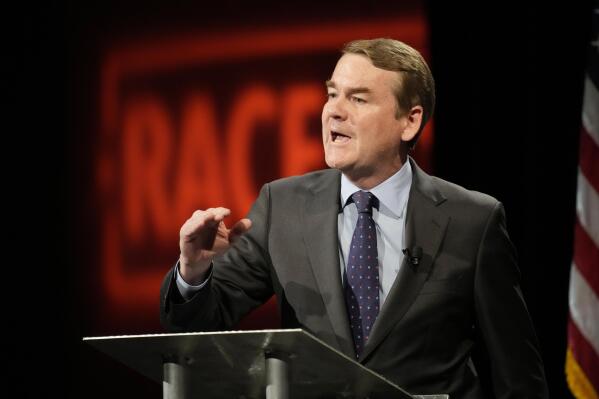 Democratic U.S. Sen. Michael Bennet speaks during a debate with Republican challenger Joe O'Dea, Friday, Oct. 28, 2022, on the campus of Colorado State University in Fort Collins, Colo. (AP Photo/David Zalubowski)