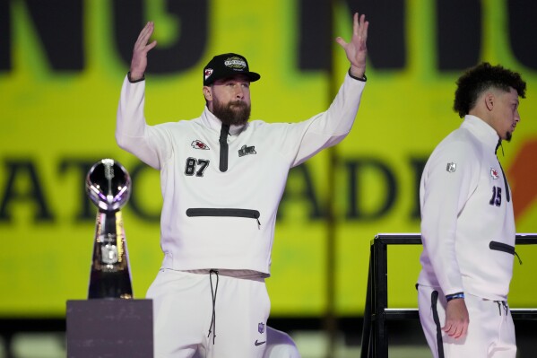 Kansas City Chiefs tight end Travis Kelce (87) and quarterback Patrick Mahomes (15) arrive for Super Bowl 59 Opening Night, Monday, Feb. 3, 2025, in New Orleans, ahead of the NFL football game between the Philadelphia Eagles and the Kansas City Chiefs Sunday. (AP Photo/Matt York)