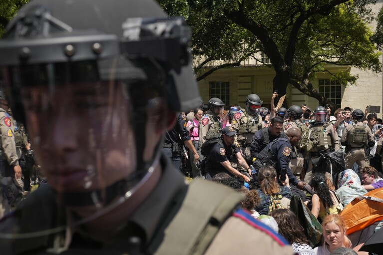 Police arrest a pro-Palestinian protester at the University of Texas in Austin, Texas, Monday April 29, 2024. (Jay Janner/Austin American-Statesman via AP)