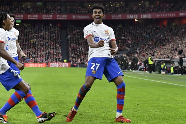 FILE - Barcelona's Lamine Yamal celebrates scoring his side's second goal, during the Copa del Rey quarterfinals soccer match between Athletic Bilbao and Barcelona at the San Mames stadium in Bilbao, Spain, on Wednesday, Jan. 24, 2024. Spain eyes record, Italy seeks redemption. Both in Group B at Euro 2024 with Croatia and Albania. (AP Photo/Alvaro Barrientos, File)