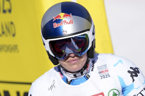 United States' Lindsey Vonn arrives at the finish area after crashing during a women's Super-G, at the Alpine Ski World Championships, in Saalbach-Hinterglemm, Austria, Thursday, Feb. 6, 2025. (AP Photo/Giovanni Auletta)