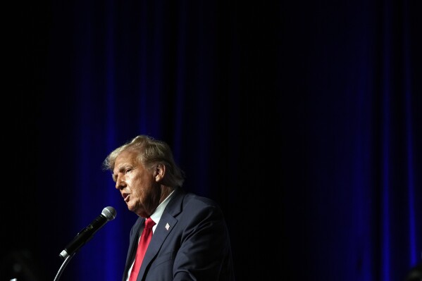 FILE - Republican presidential candidate former President Donald Trump speaks Wednesday, Oct. 11, 2023, at Palm Beach County Convention Center in West Palm Beach, Fla. Federal prosecutors and lawyers for Donald Trump will argue in court Monday, Oct. 16, over a proposed gag order aimed at reining in the former president's diatribes against likely witnesses and others in his 2020 election interference case in Washington. (AP Photo/Rebecca Blackwell, File)