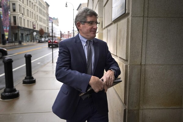 Joshua Levy, acting U.S. attorney for Massachusetts, arrives at federal court Wednesday, Nov. 22, 2023, in Worcester, Mass. Two people, Han Lee and Junmyung Lee, accused of operating a high-end brothel network with wealthy and prominent clients in Massachusetts and the Washington, D.C., suburbs will remain behind bars for now, a judge said at the court on Wednesday. (AP Photo/Steven Senne)