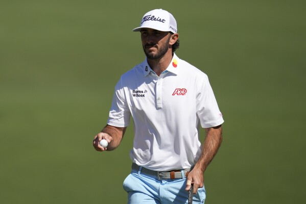 Max Homa waves after making a putt on the second hole during second round at the Masters golf tournament at Augusta National Golf Club Friday, April 12, 2024, in Augusta, Ga. (AP Photo/Ashley Landis)