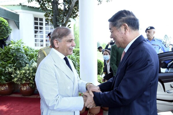 In this handout photo released by Pakistan Prime Minister's Office, Pakistan's Prime Minister Shehbaz Sharif, left, greets Chinese Vice Premier He Lifeng, in the Prime Minister house in Islamabad, Pakistan, Monday, July 31, 2023. (Pakistan Prime Minister's Office via AP)