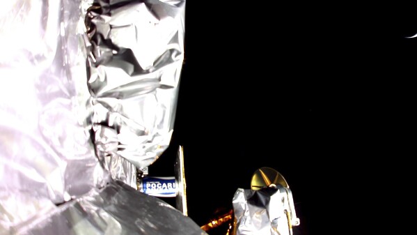 In this image from a mounted camera released by Astrobotic Technology, shows a section of insulation on the Peregrine lander. The U.S. company's lunar lander will soon burn up in Earth's atmosphere after a failed moonshot. Astrobotic Technology says its lander is now headed back from the vicinity of the moon. Company officials expect the mission to end Thursday. (Astrobotic Technology via AP)