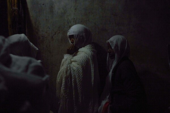 Ethiopian Orthodox Christian worshippers gather for Palm Sunday celebrations at the Ethiopian monks' quarters on the rooftop of the Church of the Holy Sepulcher, the place where Christians believe Jesus Christ was crucified, buried and resurrected, in Jerusalem, Sunday, April 13, 2025. (AP Photo/Ohad Zwigenberg)